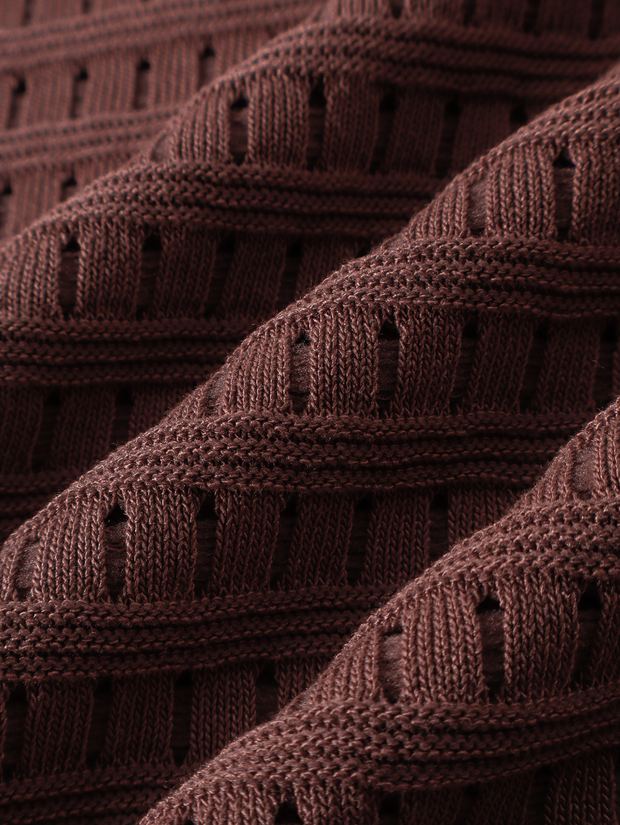 Close-up of the waffle knit on a dark red polo